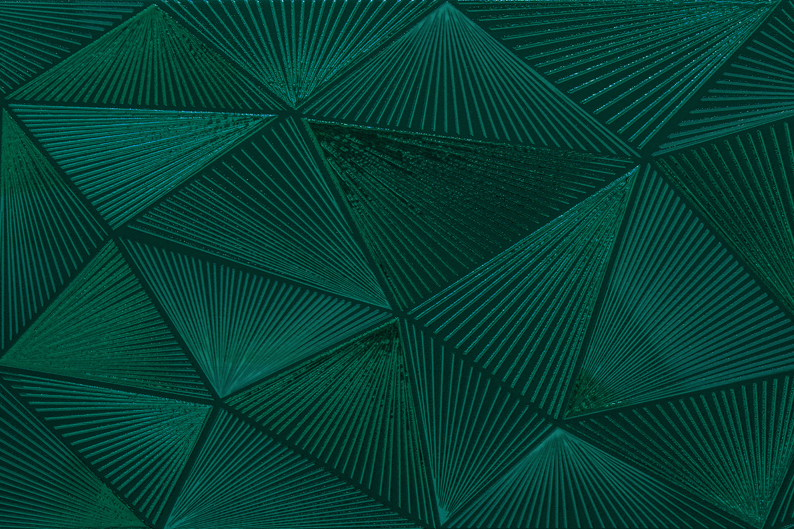 Green triangle pattern on a green surface Green triangle pattern on a green surface