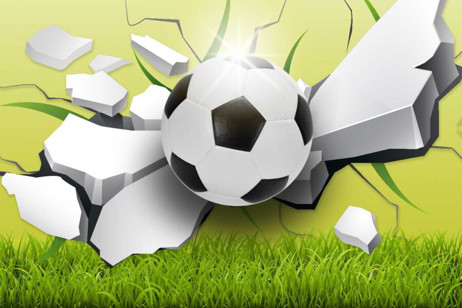 Futball labda áttörése egy falon