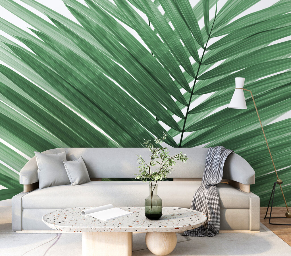 Lush green palm leaves against white