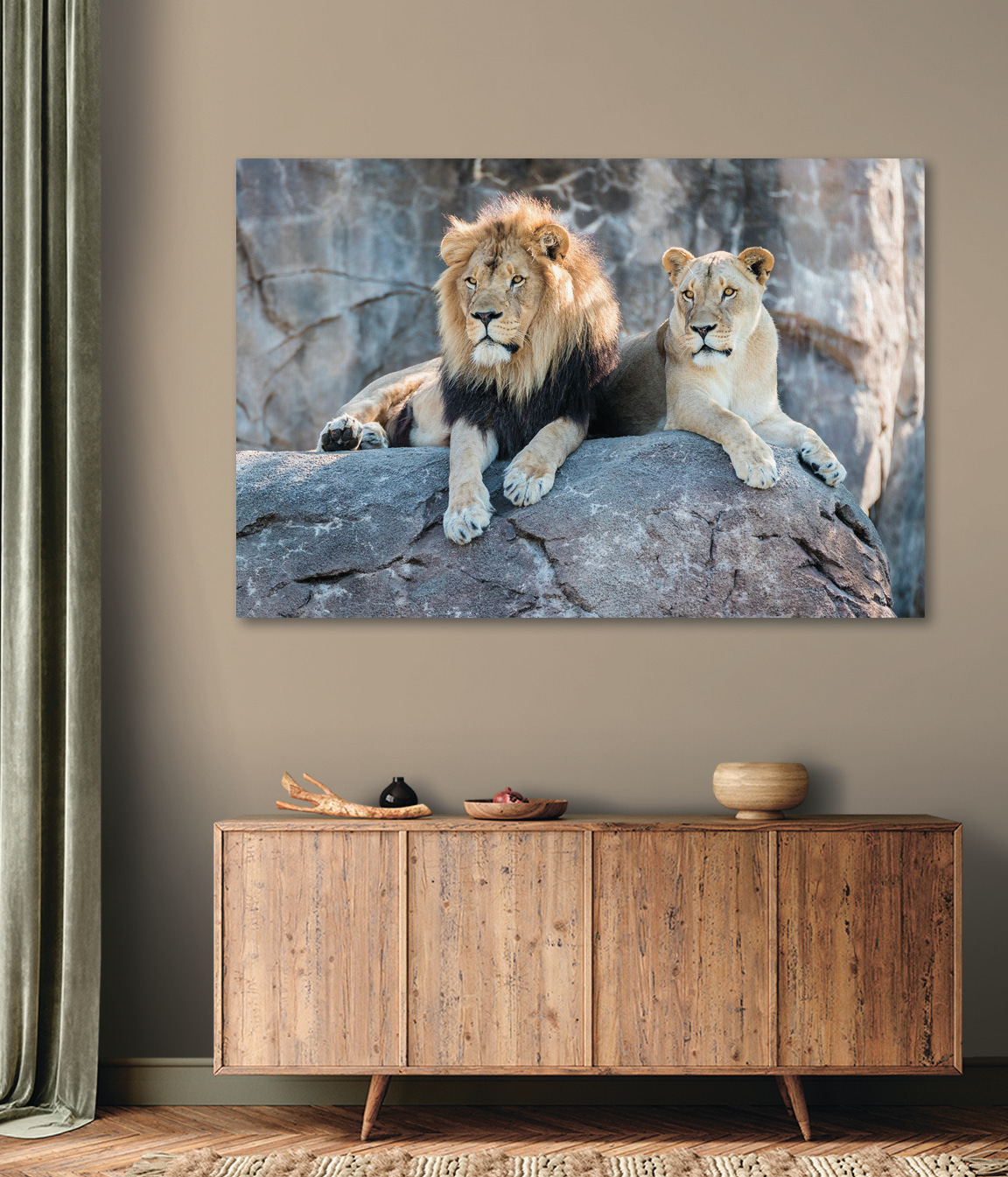 A couple of lions lying on a rock A couple of lions lying on a rock