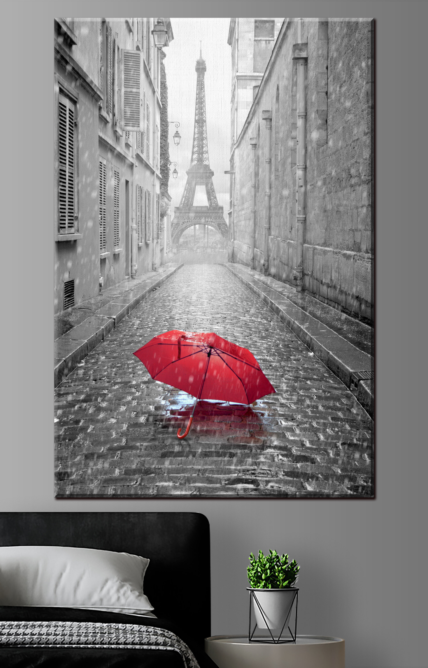 A red umbrella in a street with a tower in the background A red umbrella in a street with a tower in the background