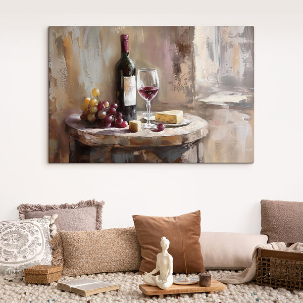 A wine bottle and grapes on a table