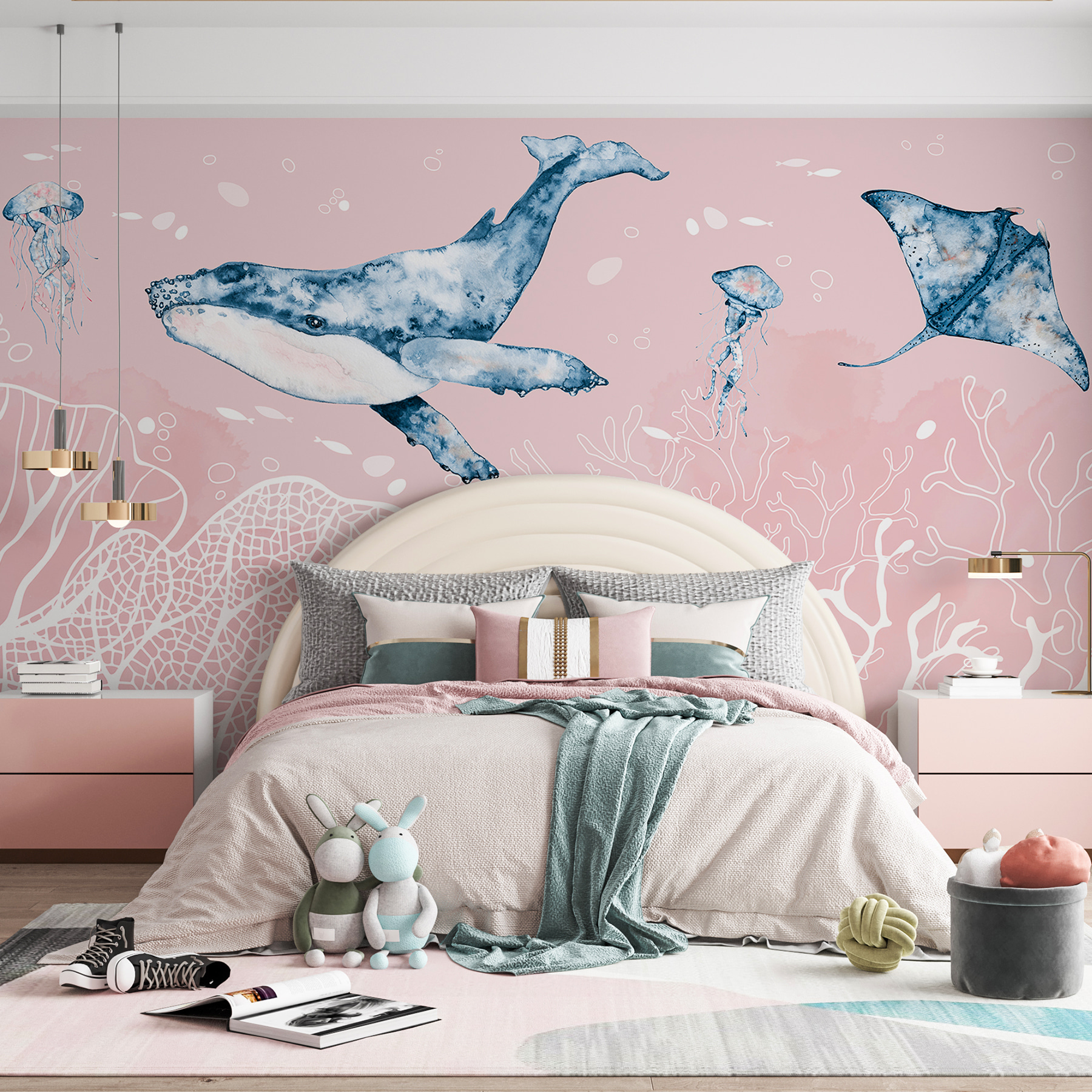 A whale and stingrays swimming in the ocean