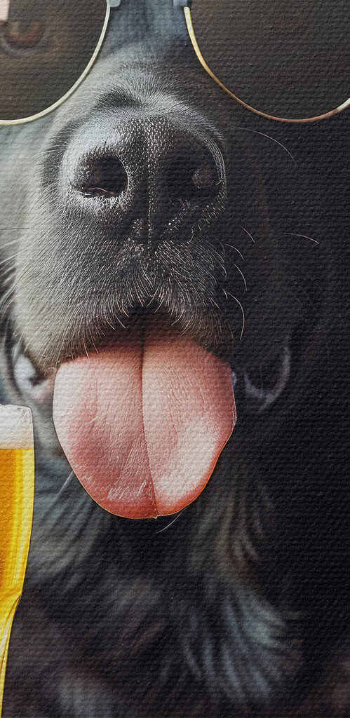Dog wearing sunglasses and holding a glass of beer