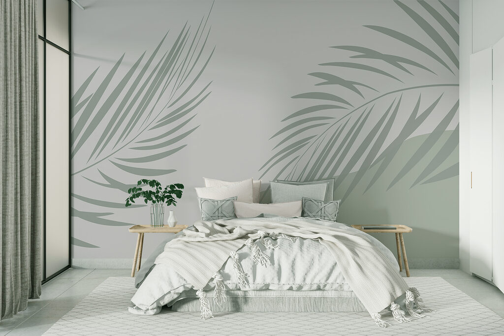 Palm leaves on a grey background