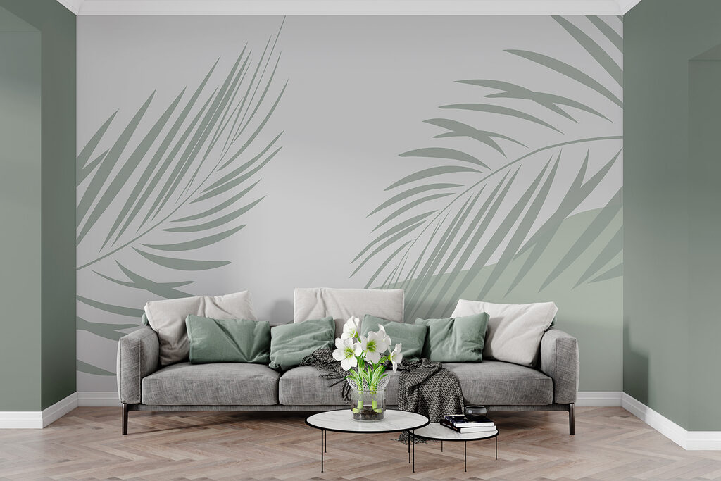 Palm leaves on a grey background