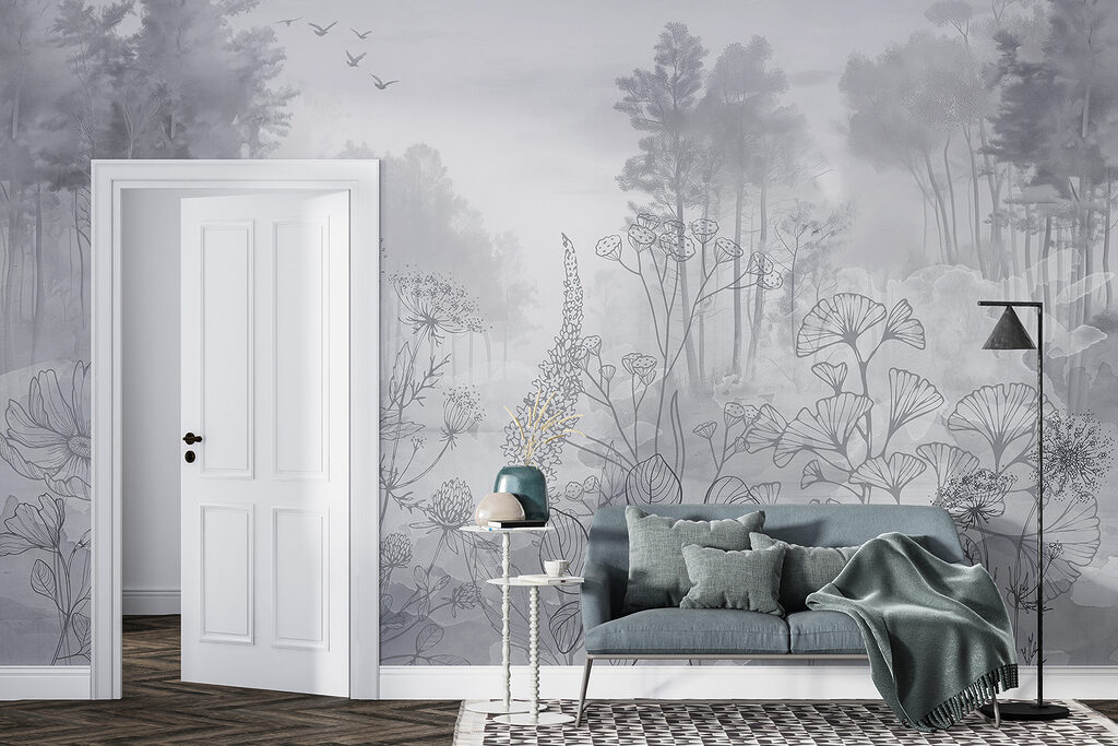 Greyscale image of a forest with birds flying