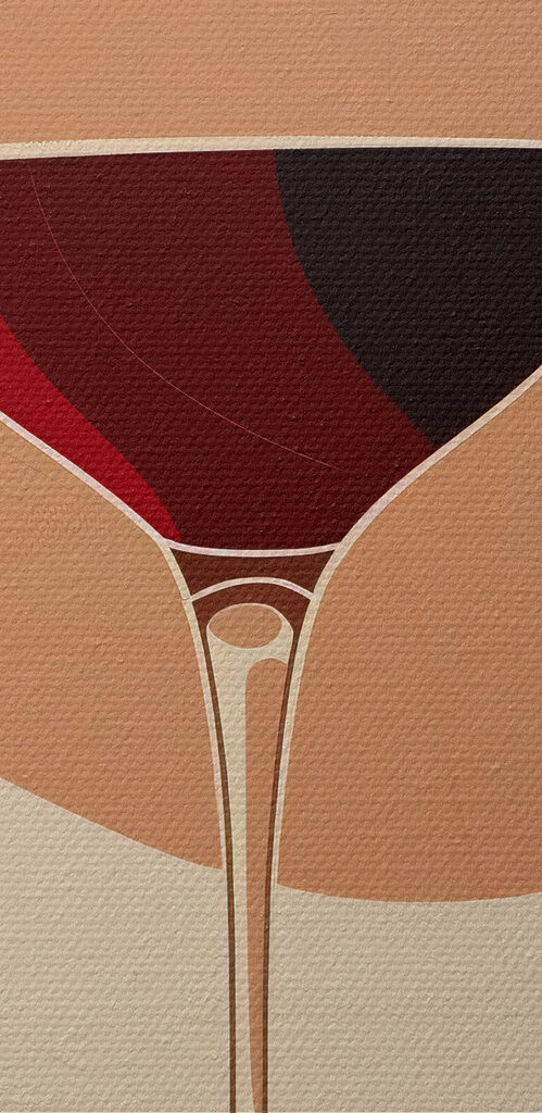 Glass of wine with a red liquid in it