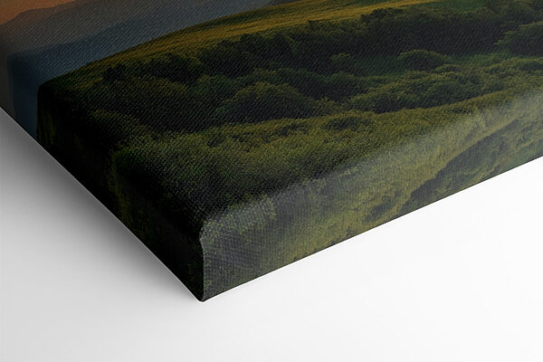 Sunset over a green hill