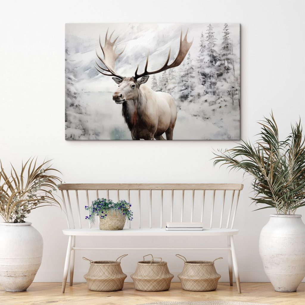 Moose with large antlers standing in a snowy forest