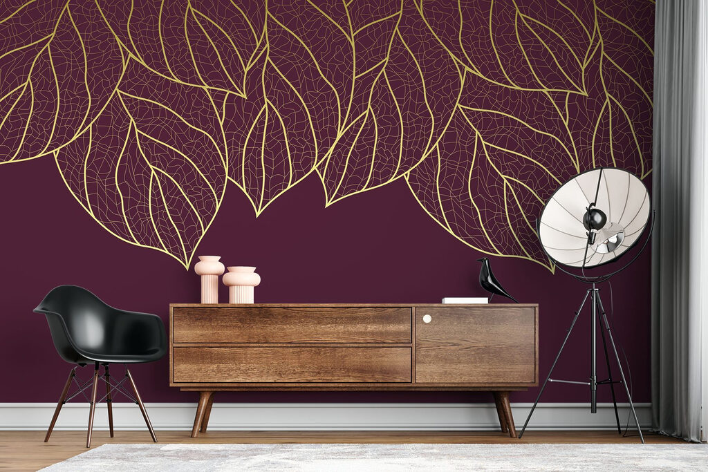Elegant leaves on deep maroon background