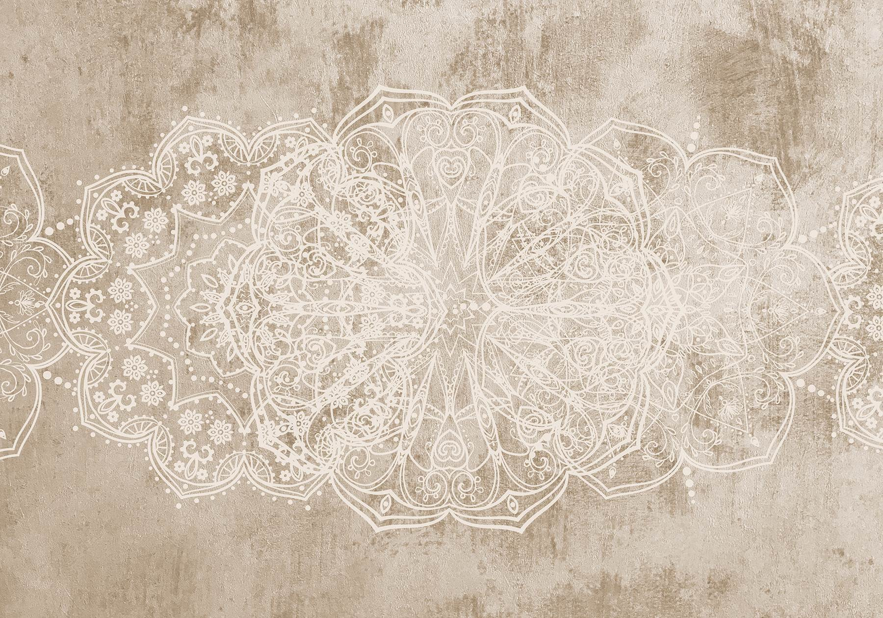 White ornate design on a brown surface