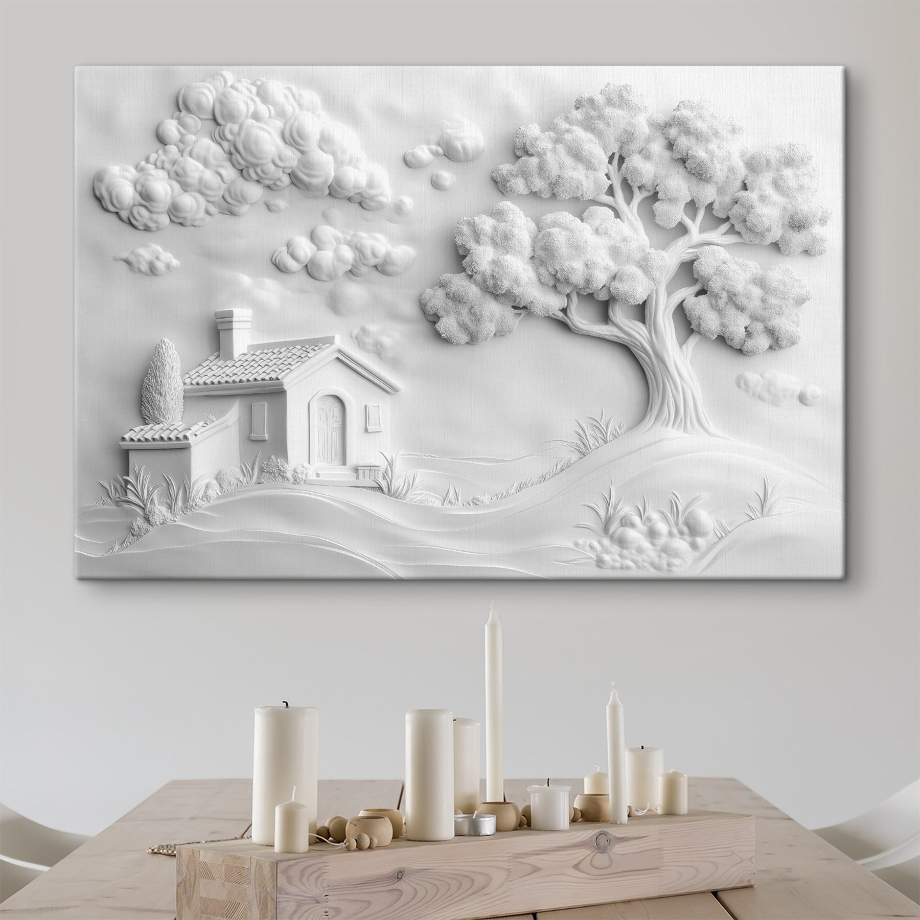 White wall art with a house and tree