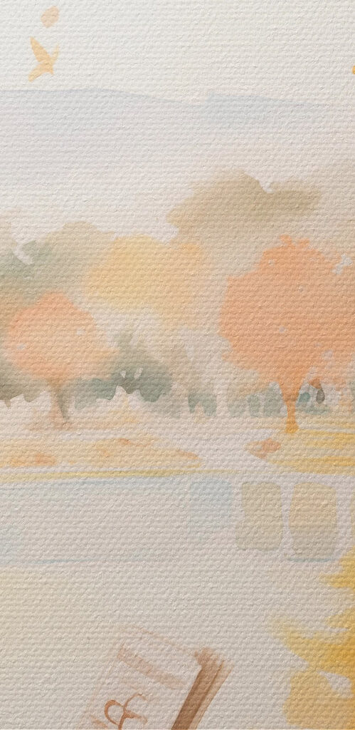 Woman sitting on a window sill reading a book