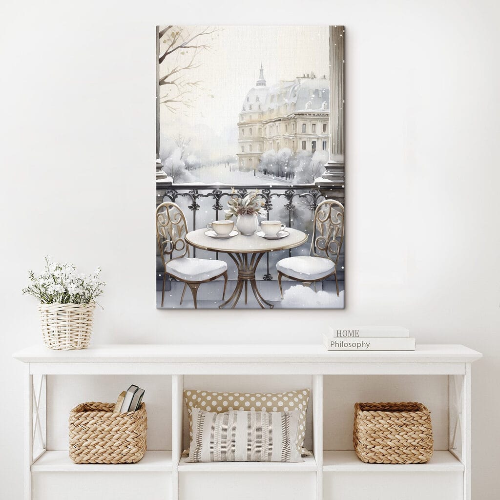 Table with cups and a vase of flowers on it with a snowy landscape