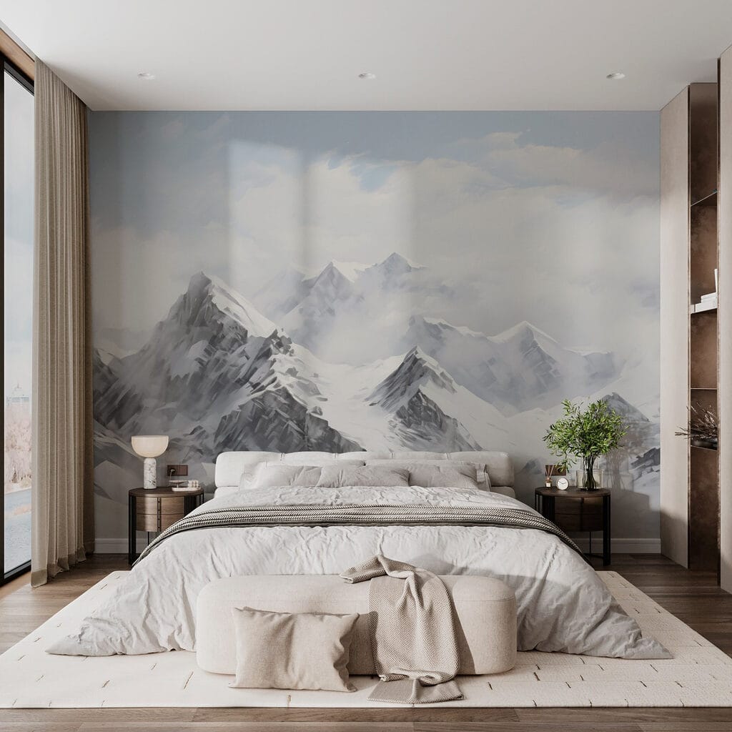 Snowy mountain range with clouds