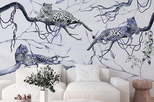 Group of leopards lying on branches