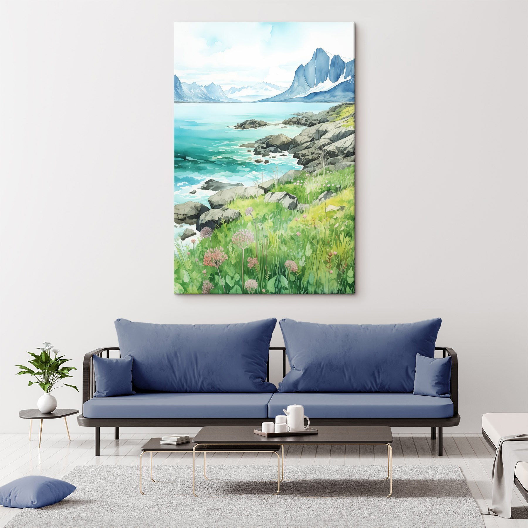 Watercolor painting of a rocky shore with mountains and a blue sky