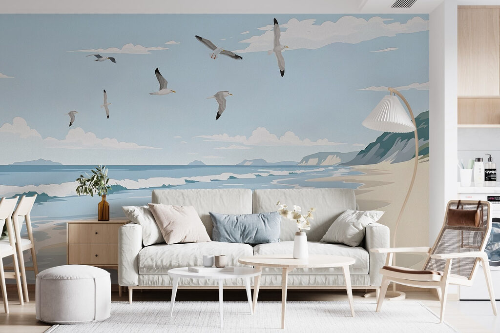 Beach with birds flying over it