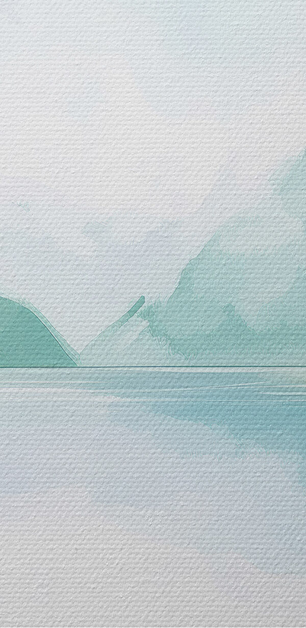 Water with trees and mountains in the background