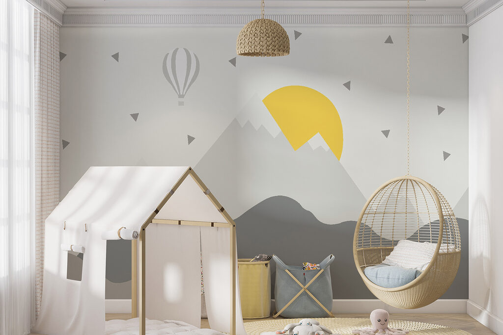 Mountain landscape with a hot air balloon and a sun