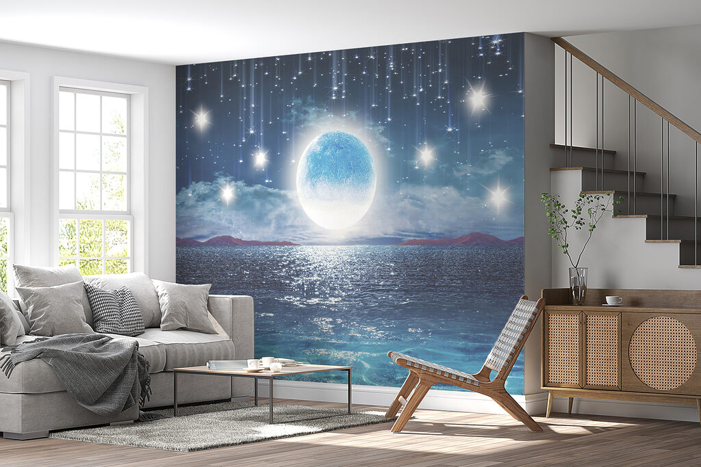 Moon over water with stars and clouds