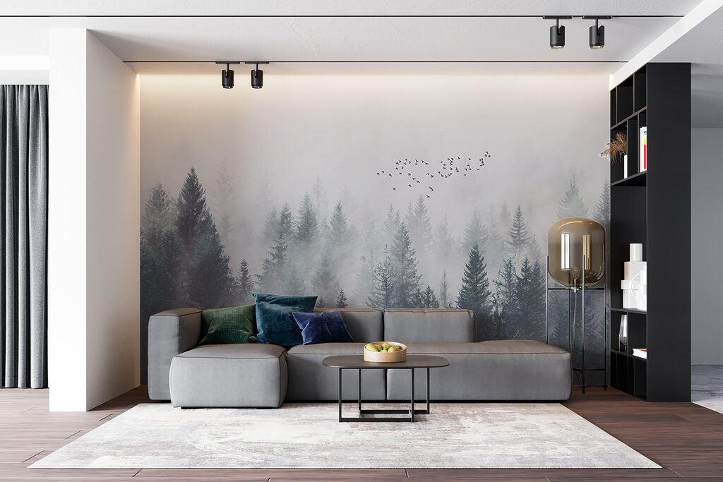 Group of birds flying over a forest