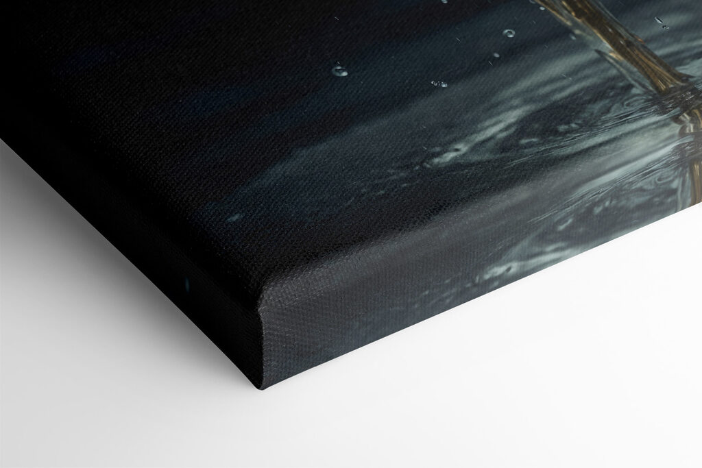 A white flower with yellow center and water splashing out