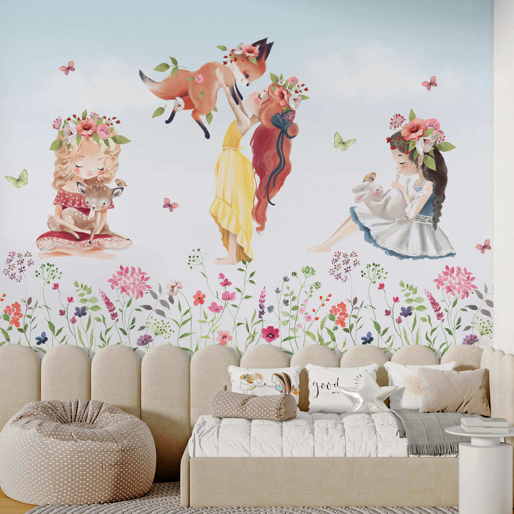 Group of girls holding animals in a field of flowers Group of girls holding animals in a field of flowers