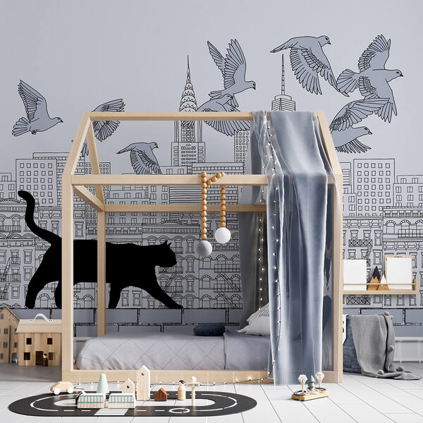 Macska sétál a falon, madarak repülnek az égen