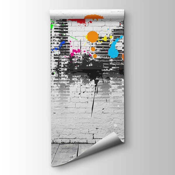 White brick wall with colorful paint splatters White brick wall with colorful paint splatters