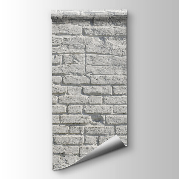 White brick wall with black spots