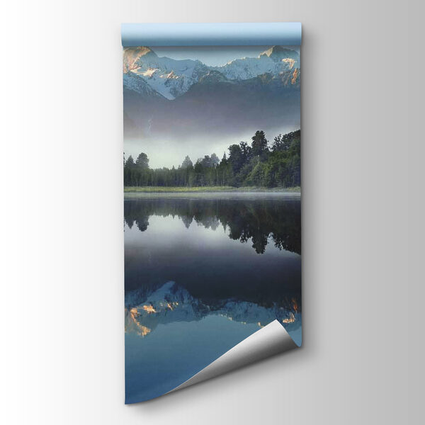 Lake with trees and mountains in the background