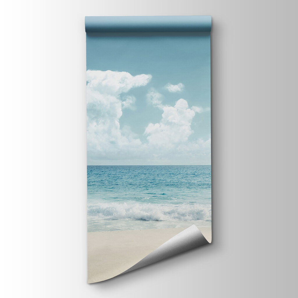 A beach with waves crashing on the sand