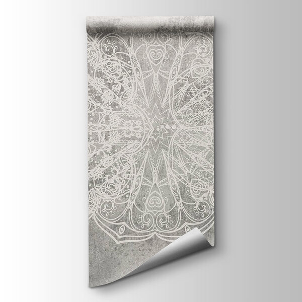 White ornate design on a grey surface White ornate design on a grey surface