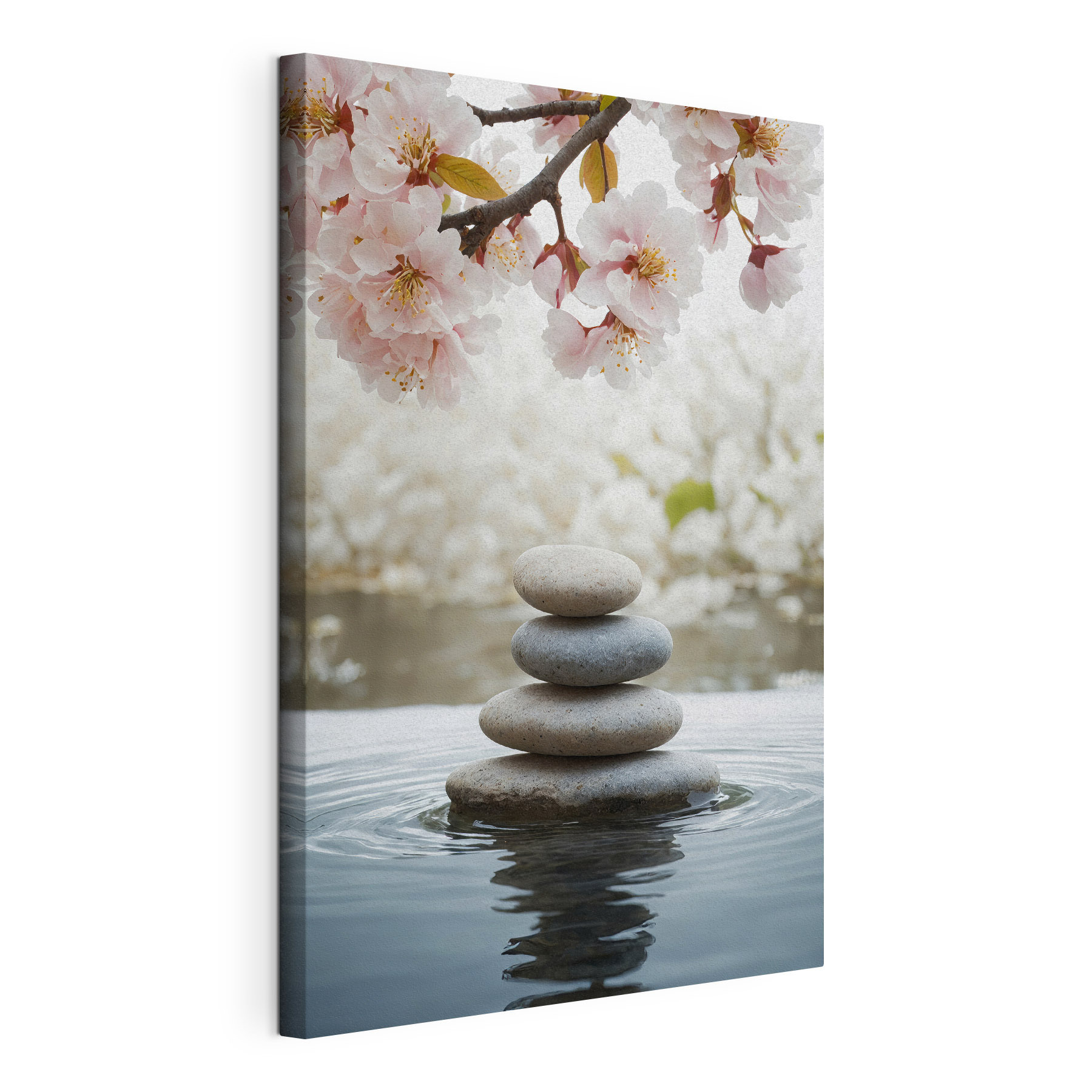Stack of rocks in water with flowers in the background