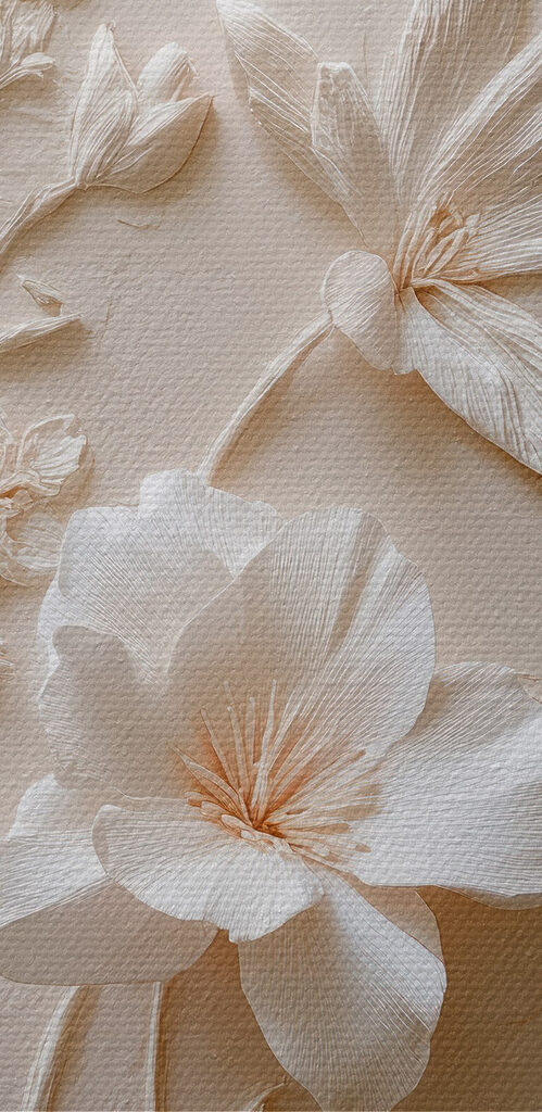 White flower embroidery on a white surface
