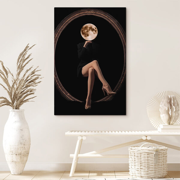 Woman sitting in a chair with a moon in her face