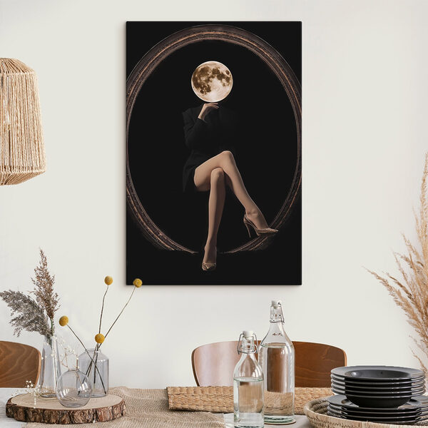 Woman sitting in a chair with a moon in her face