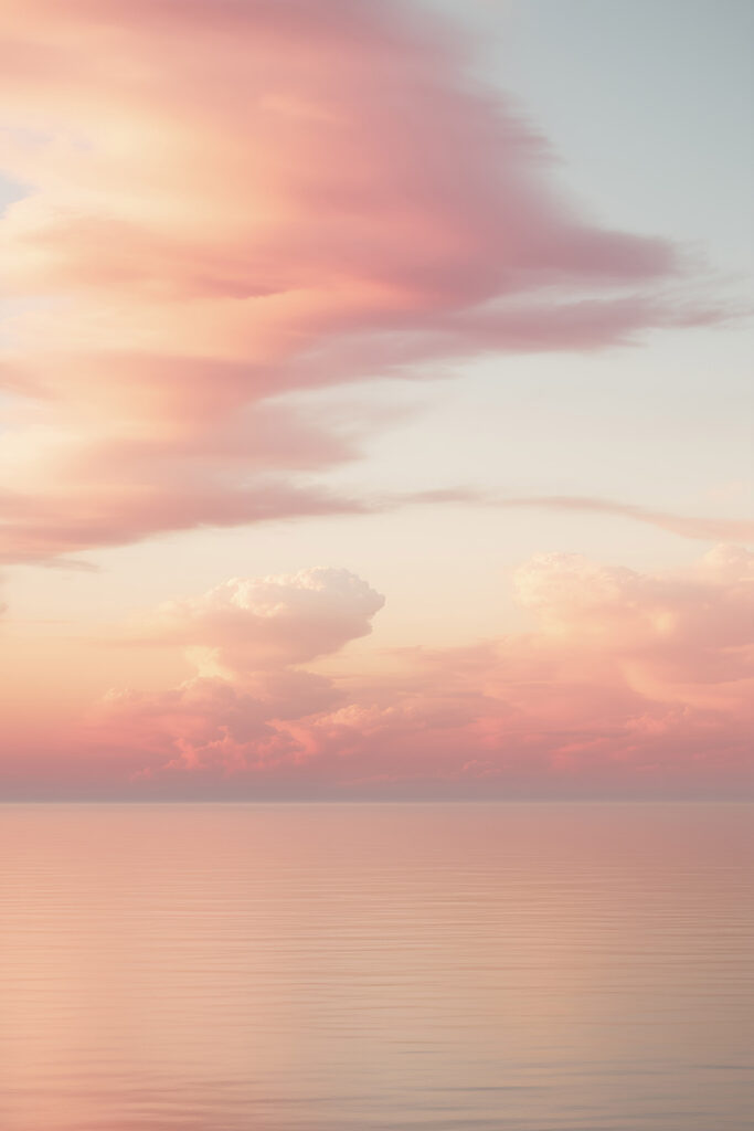 Pink clouds over water