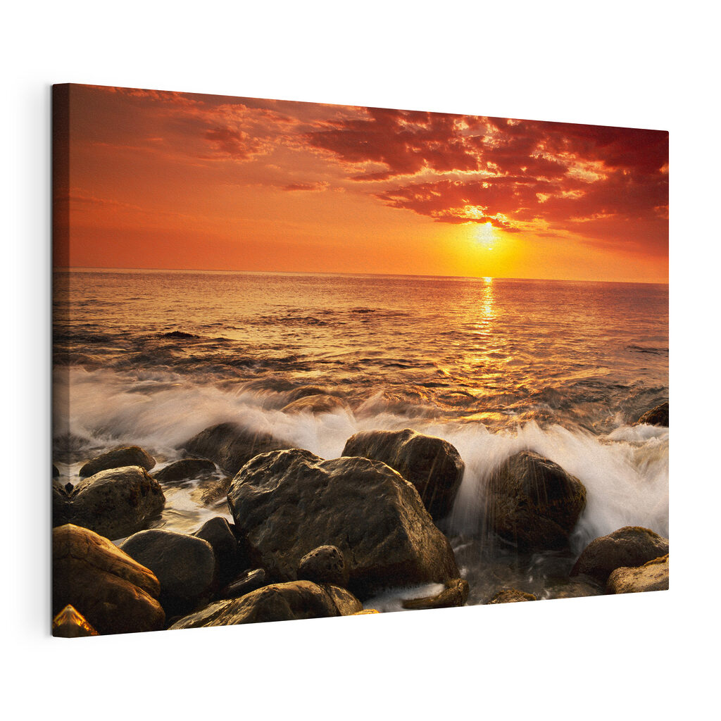 A sunset over a rocky beach A sunset over a rocky beach