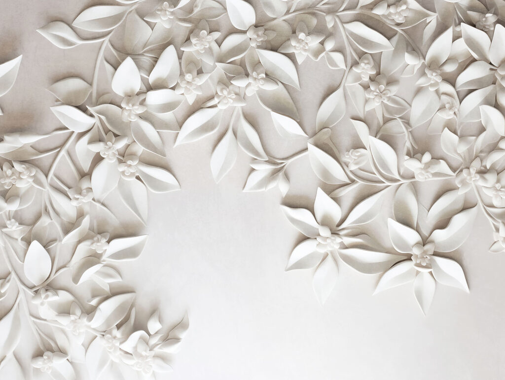 White wall with white flowers and leaves