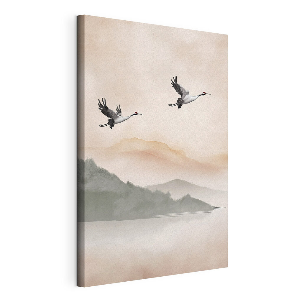 Two birds flying over a lake